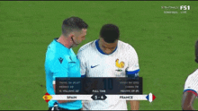 a soccer game between spain and france is being shown on tv