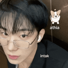 a close up of a person wearing glasses with athia intak and a dog icon