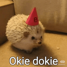 a small hedgehog wearing a birthday hat with the number 8 on it .