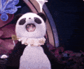 a stuffed panda bear with a girl in it 's mouth