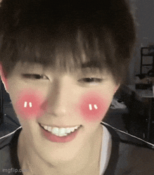 a close up of a person with red cheeks and a smile
