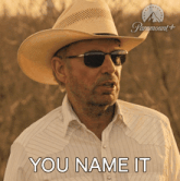 a man wearing a cowboy hat and sunglasses has the words you name it below him