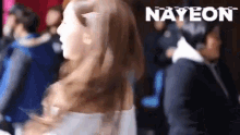 a blurry picture of a woman with the word nayeon written on the bottom