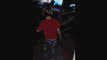 a young boy wearing a red shirt that says we laugh