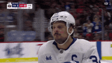 a hockey player wearing a jersey that says milk on it