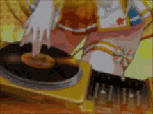 a woman is playing a record on a turntable