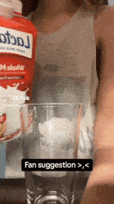 a woman is pouring milk into a glass with a fan suggestion written below it