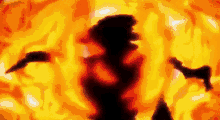 a person is standing in front of a fireball .