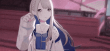 a girl with long blonde hair is wearing a white jacket and a blue shirt .