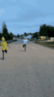 a blurry picture of two people walking down a street .