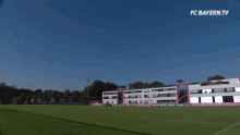 a soccer field with the words fc bayern.tv on the top