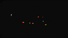 a blurry image of the word xcalia with a black background