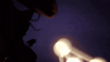 a blurred image of a light bulb with the letters c on it