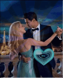 a man and woman are dancing in front of the eiffel tower and a heart that says vice