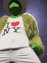 a person wearing a white shirt that says i heart ny