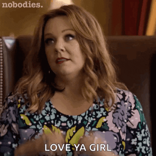 a woman is sitting in a chair and says love ya girl