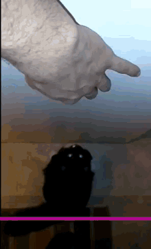 a statue of a hand pointing at something in a room