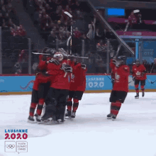 hugging team canada embrace goal excited