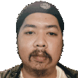 a man with a beard is wearing a hat on his head