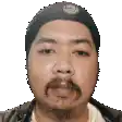 a man with a beard is wearing a hat on his head