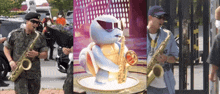 a man in a military uniform plays a saxophone in front of a statue of a turtle