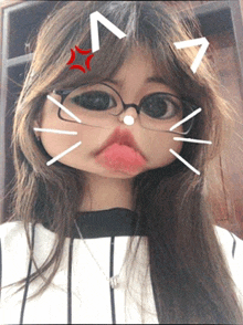 a girl wearing glasses and a striped shirt makes a cat face