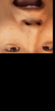 a close up of a person 's nose with a blurred background .