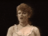 a woman in a white dress says " i think i 'm fainting ... "