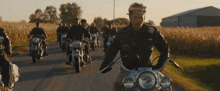 Benny Riding His Motorbike Along With A Group Of Motorcyclists The Bikeriders Film GIF - Benny Riding His Motorbike Along With A Group Of Motorcyclists The Bikeriders Film The Bikeriders GIFs