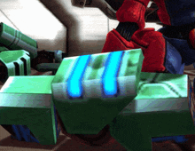 a green cube with a blue stripe on the bottom