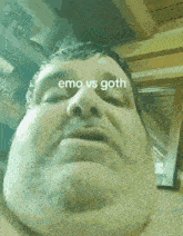 a close up of a man 's face with the words emo vs goth on the bottom