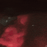 a man is dancing in front of a fire at night .