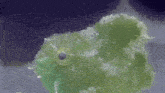 a close up of a green object with white spots on it .