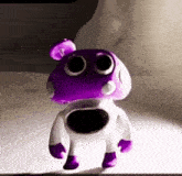 a purple and white cartoon character with big eyes is standing on a table .
