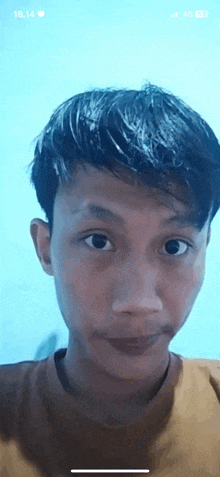 a young man is taking a picture of himself on a cell phone