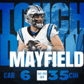 a football player named mayfield is holding a ball