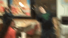 a blurry picture of a person standing in front of a window