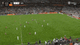 a woman is crying while watching a soccer game on tnt sports