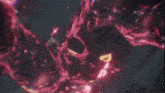 a person is being attacked by a monster in a video game with a lot of red and blue lights coming out of it .