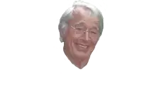 a man with glasses and gray hair is smiling
