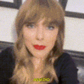 a close up of a woman 's face with red lipstick and the word assed on the bottom .