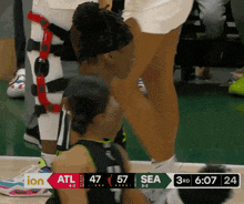a basketball game between atl and sea is being shown