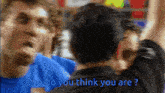 a blurry picture of two men with the words who do you think you are