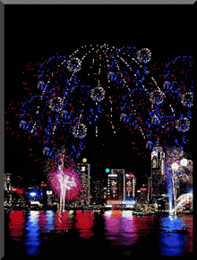 a painting of a fireworks display over a body of water