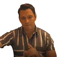 a man in a striped shirt is making a gesture with his hands