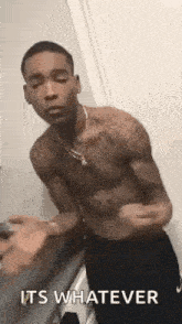 a shirtless man is standing in front of a door and says `` it 's whatever '' .