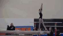 gymnastics flip kick over balance beam bethany grieve