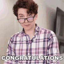 a man wearing glasses and a plaid shirt with the words congratulations on the bottom