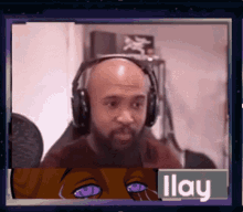 a man wearing headphones with the name ilay on the bottom of the screen