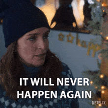 a woman wearing a blue beanie and sweater says it will never happen again